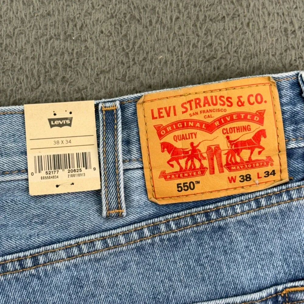 Levi's 550‎ Relaxed Fit Mens 38x34 Light Wash Blue Denim Jeans 100% Cotton